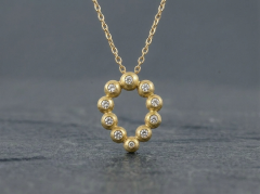 Dr�be vedh�ng i guld med diamanter